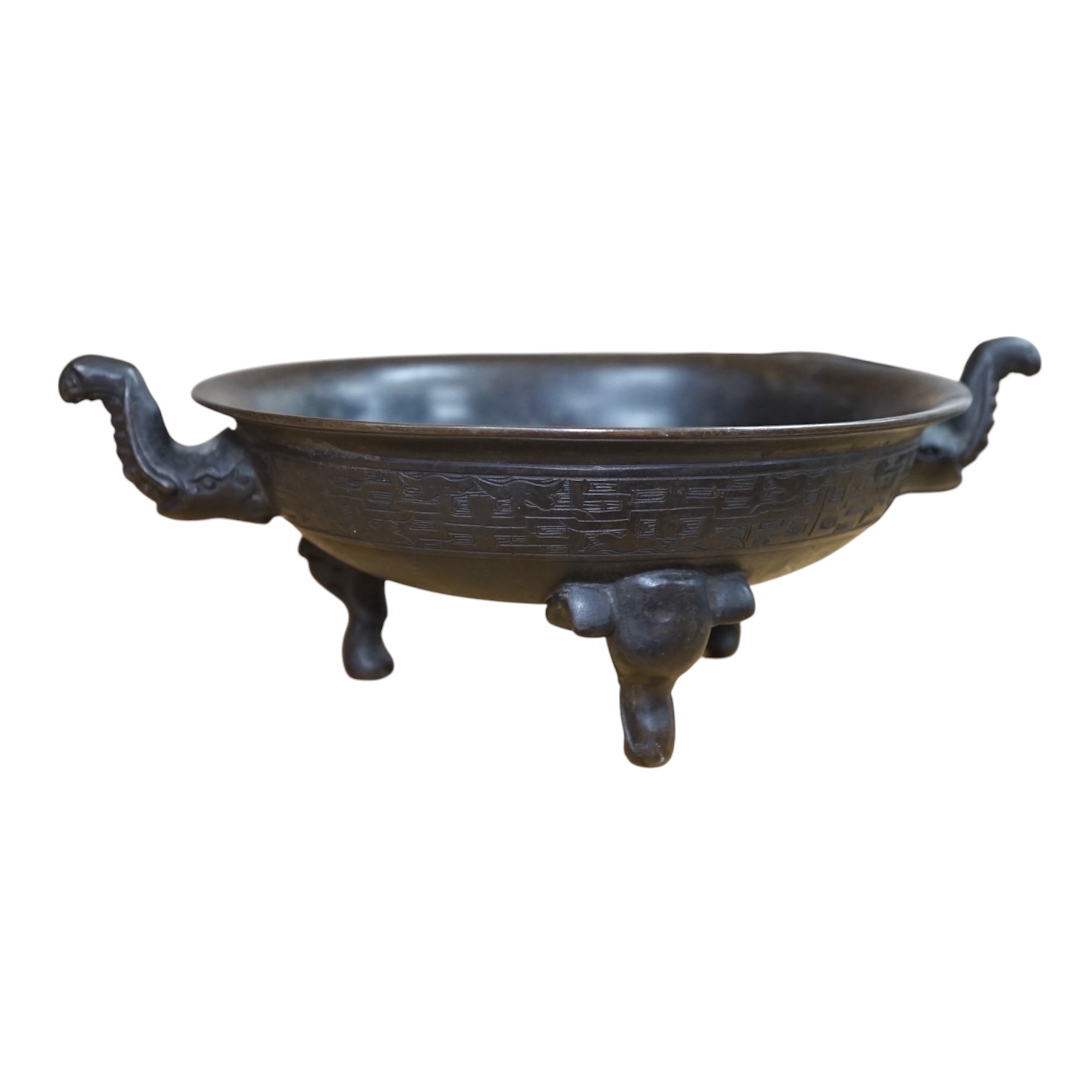 A Chinese archaistic bronze tripod ‘elephant head’ censer, Xuande mark, 19th century, 24cm handle to handle. Condition - fair to good